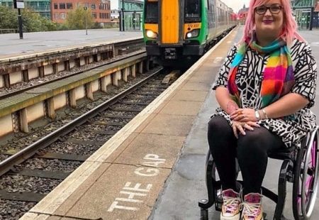 Picture of a lady in a wheelchair next to a railway track